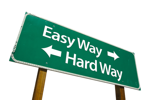 Easy Way, Hard Way Green Road Sign Isolated on a White Background with Clipping Path.